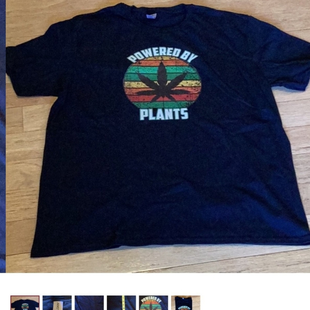 Classic black men's tee by Gildan.  Graphics on front only"powered by plants".